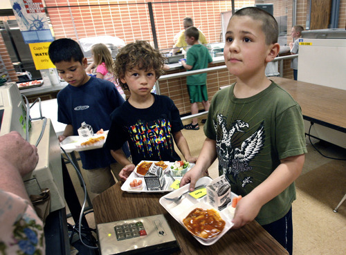 Scott Sommerdorf  |  The Salt Lake Tribune             
At East Sandy Elementary, recess comes before lunch, a shift health officials are urging to help fight obesity. Ty Standiford stands in the front of the line for lunch checkout. Behind him to the left is Grae Moore, followed by Thomas Kolo.