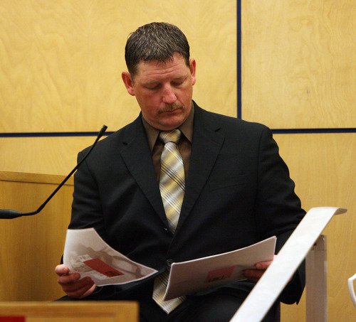 Steve Griffin | The Salt Lake Tribune

West Valley City police Detective Ellis Maxwell looks at evidence, from the witness stand, during the voyeurism trial for Steve Powell, the father-in-law of missing Utah woman Susan Powell, in Pierce County Superior Court  in Tacoma, Wash., on Monday May 14, 2012.