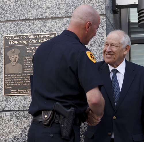 Trent Nelson  |  The Salt Lake Tribune
Salt Lake City police chief Chris Burbank shakes hands with Bill Farley, whose father, Salt Lake City police officer Owen T. Farley, was killed at 300 South State Street in 1951. The dedication of officer Farley's memorial plaque was held Tuesday, May 15, 2012 in Salt Lake City, Utah.