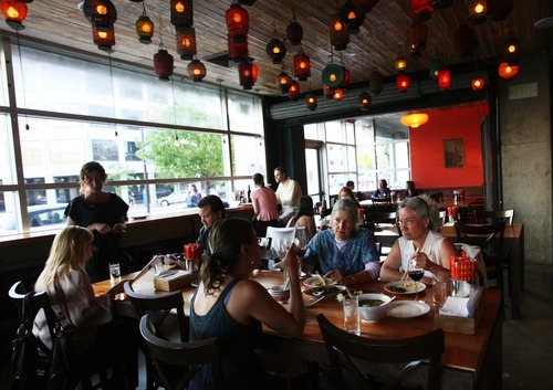 Kim Raff | The Salt Lake Tribune
Long tables that seat 8, 10, 12 or more have been part of bars, barbecue joints and pizzerias for many years. But now communal tables are moving beyond casual eateries and into upscale restaurants, including Plum Alley in Salt Lake City.