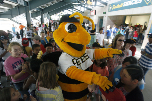Francisco Kjolseth  |  The Salt Lake Tribune
Bumble the Bee is surrounded by kids as the Salt Lake Bees host the Albuquerque Isotopes on Tuesday, May 15, 2012, as baseball tries to grow the next generation of fans through things like Tuesday's annual school day game at Spring Mobile Ballpark.