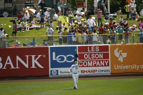 Francisco Kjolseth  |  The Salt Lake Tribune
Elementary school kids crowd the outfield as Ed Lucas of the Salt Lake Bees catches an easy one as they host the Albuquerque Isotopes on Tuesday, May 15, 2012. Baseball who tries to grow the next generation of fans through things like Tuesday's annual school day game at Spring Mobile Ballpark, filled most of the stadium with kids as Summer break soon approaches.