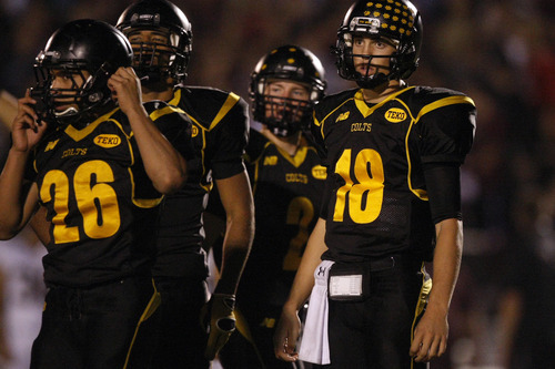 Tribune file photo
Cottonwood High School quarterback Cooper Bateman (No. 18), one of the most heavily recruited players in Utah history, has orally committed to Alabama, passing on more than 50 offers.