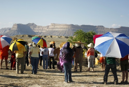 Kim Raff | The Salt Lake Tribune
Protesters listen to speakers during a rally near the proposed construction site for nuclear reactors in Green River, Utah on May 19, 2012.