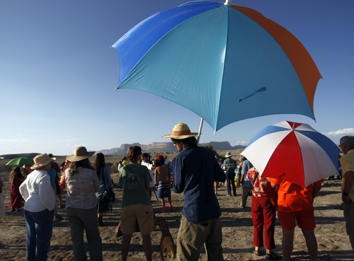 Kim Raff | The Salt Lake Tribune
(center) Neal Clark stands with other protesters while listening to speakers during a rally near the proposed construction site for nuclear reactors in Green River, Utah on May 19, 2012.