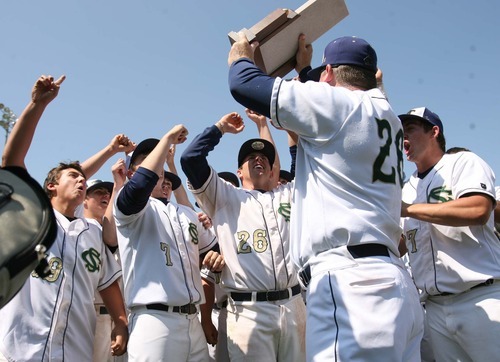 Leah Hogsten  |  The Salt Lake Tribune
 Snow Canyon's head coach Reed Secrist celebrates winning the championship trophy with the team. Snow Canyon High School boys baseball team defeated Juan Diego during their final 3A State Championship Game 5-1 Saturday, May 19 2012 in Kearns.