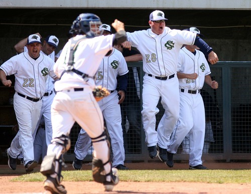 Leah Hogsten  |  The Salt Lake Tribune
 Snow Canyon's coach Reed Secrist and players leap out of the dugout to congratulate pitcher Austin Ovard for a shut out 6th inning. Snow Canyon High School boys baseball team defeated Juan Diego during their final 3A State Championship Game 5-1 Saturday, May 19 2012 in Kearns.