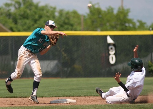 Leah Hogsten  |  The Salt Lake Tribune
Juan Diego's Alex Gudac makes the out at second on  Snow Canyon's Mason Smith and throws to first for the double. Snow Canyon High School boys baseball team defeated Juan Diego during their final 3A State Championship Game 5-1 Saturday, May 19 2012 in Kearns.