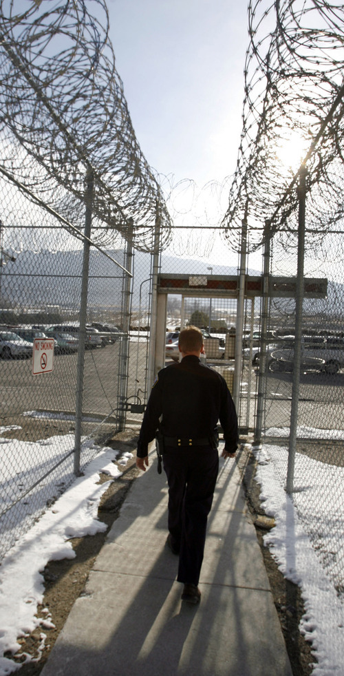 Steve Griffin  |  Tribune file photo
Corrections officer Ron DeMill walks out of the Oquirrh Four section of the Utah State Prison where he works Dec. 14, 2005. Utah Department of Corrections officers make far less that their counterparts at county jails.
