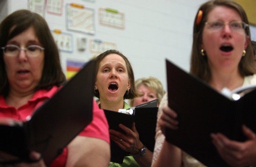 Kim Raff | The Salt Lake Tribune
Singers with Utah Voices rehearse for their upcoming 