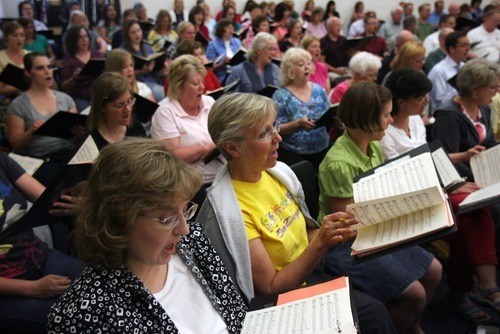 Kim Raff | The Salt Lake Tribune
Singers with Utah Voices rehearse for their upcoming 