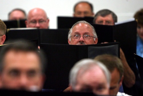 Kim Raff | The Salt Lake Tribune
Ken Korbett looks out from behind his music during the Utah Voices rehearsal for their upcoming 