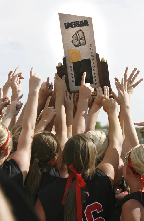 Paul Fraughton / Salt Lake Tribune
The Bear River softball team hoists the 3A championship trophy into the air after their win over  Spanish Fork.

 Monday, May 21, 2012