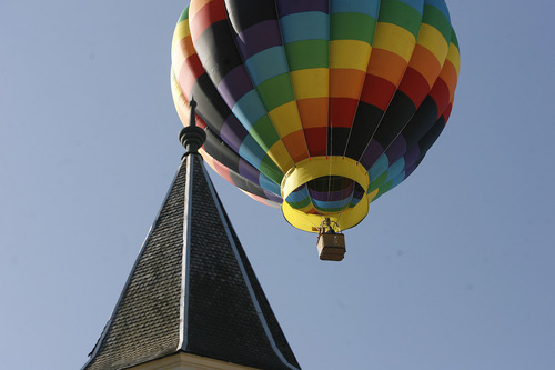 Scott Sommerdorf  |  The Salt Lake Tribune             
During the early part of the dedication ceremony on Saturday, a hot air balloon floated over the old tabernacle building. The LDS Church broke ground for the Provo City Center Temple, formerly known as the Provo Tabernacle.