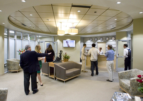 Paul Fraughton / Salt Lake Tribune
Visitors walk through the offices of the World Trade Center at City Creek at 60 East South temple at an open house.

 Wednesday, May 23, 2012