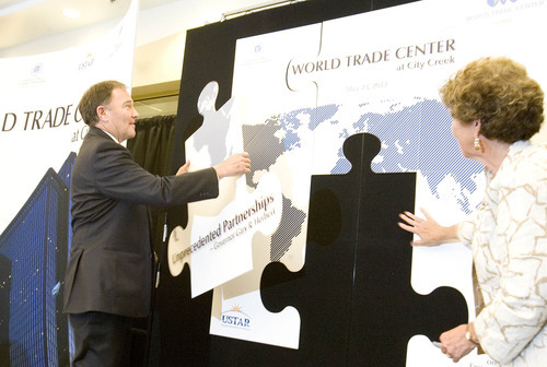 Paul Fraughton / Salt Lake Tribune
Governor Gary Herbert, as part of the ceremony  inaugurating the World Trade Center at City Creek, puts a final puzzle piece into place marking the date and the partners involved with the center  at 60 East South temple.

 Wednesday, May 23, 2012