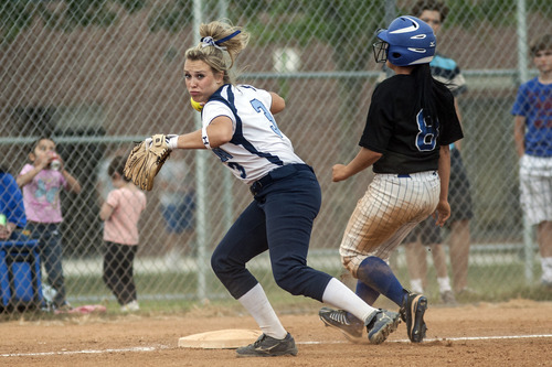 Chris Detrick  |  The Salt Lake Tribune
Layton's Lauryn Kirschner, 3, forces out Taylorsville's Aaliyah Valenzuela, 8, at third base during the game at Taylorsville High School. Taylorsville won the game 2-1.