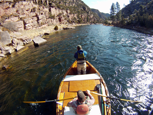Francisco Kjolseth  |  The Salt Lake Tribune    
Richard Hemingway strips his line while good friend Jeremy Christensen mans the oars of his personally hand made dory while floating the A section of the Green River in late March. The river, which meanders about 730 miles from its headwaters in the Wind River Range in Wyoming through Utah, Colorado and back into Utah, is No. 2 on the list of America's Most Endangered Rivers of 2012, according to a new report by American Rivers. The report cites proposed pipelines and a nuclear power plant that would remove huge portions of water as major threats to the river.