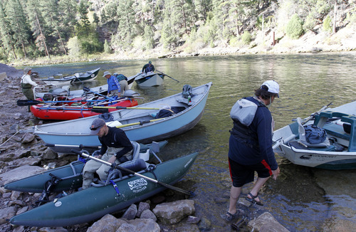 Al Hartmann  |  The Salt Lake Tribune

Anglers prepare at the boat ramp just below Flaming Gorge Dam for their float down the Green River. The river, which meanders about 730 miles from its headwaters in the Wind River Range in Wyoming through Utah, Colorado and back into Utah, is No. 2 on the list of America's Most Endangered Rivers of 2012, according to a new report by American Rivers. The report cites proposed pipelines and a nuclear power plant that would remove huge portions of water as major threats to the river.