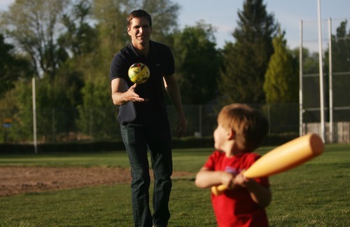 Kim Raff | The Salt Lake Tribune
Josh Romney, son of presidential hopeful Mitt Romney, pitches a ball to his son, Nash, while at baseball practice for another son at a Holladay LDS stake house ball field. Josh Romney has been hitting the campaign trail for his father but tries to be home in Utah as much as possible for his family.