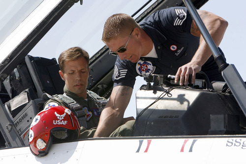 Francisco Kjolseth  |  The Salt Lake Tribune
Police Officer Shawn Grogan of the Ogden-Weber Narcotics Task Force, gets last minute instruction from Raymond LeBlanc as he gets ready to fly in a Thunderbird F-16 with pilot Lt. Col. Jason Koltes as part of the Thunderbird's Hometown Hero Program on Thursday, May 24, 2012, out of Hill Air Force Base. Grogan was one of the officers injured in a raid back in January that killed a fellow officer.