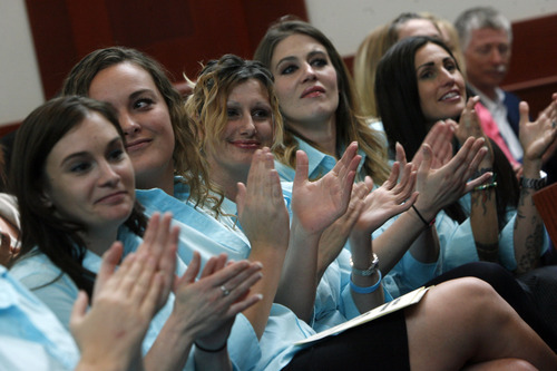 Francisco Kjolseth  |  The Salt Lake Tribune
The House of Hope choir applauds new graduates as Third District Juvenile Court hosts a graduation ceremony at the Scott M. Matheson Courthouse on Wednesday, May 23, 2012, for 20 Drug Court participants of the Family Dependency Drug Court and the Delinquency Drug Court. Drug Court graduates have completed substance abuse treatment services, frequent drug testing, and close monitoring by the court. After successfully completing the program, Family Dependency Drug Court participants are reunified with their children, while Delinquency Drug Court participants have their charges dismissed.
