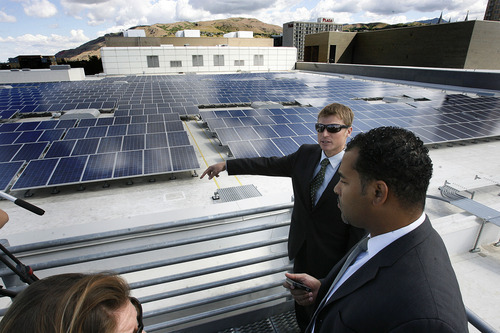 Scott Sommerdorf  |  The Salt Lake Tribune             
Andy Blakeslee, with Bella Energy, leads a tour of the solar array atop the Salt Palace Thursday. The 1.65 megawatt array of solar panels on top of the Salt Palace Convention Center is complete.