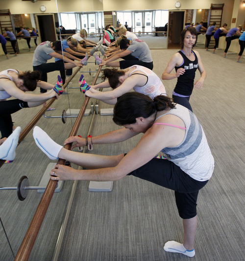 Al Hartmann  |  The Salt Lake Tribune
Class participants stretch on the ballet bar at The Bar Method class in Salt Lake City.   The class uses ballet bars for stretching and flexibility, balance and core strengthening to feel fit.