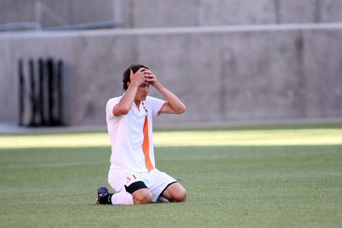 Kim Raff | The Salt Lake Tribune
Murray player Thomas Rodriquez reacts to a Olympus goal during the 4A State Championship game at Rio Tinto Stadium in Sandy, Utah on May 24, 2012. Olympus went on to win the game 3-2.