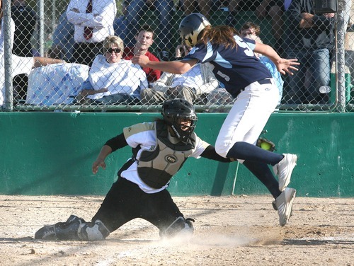 Paul Fraughton / Salt Lake Tribune
Roy catcher Caylie Phelts  blocks home plate and makes the tag on Brooke Ford of Salem Hills .

 Thursday, May 24, 2012