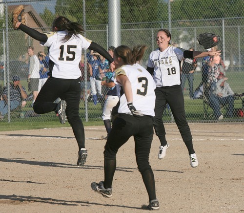 Paul Fraughton / Salt Lake Tribune
Pitcher Jamie Aiken,15, Bryce Mitchell,3, and Kylee Blau,18,  leap into the air  after the final out giving  The Royals the State 4A Championship in softball.

 Thursday, May 24, 2012