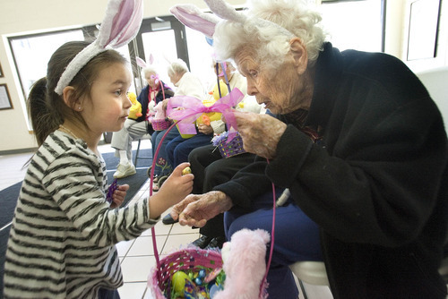 Paul Fraughton | The Salt Lake Tribune.
Three-year-old Malaiah Martinez holds a chocolate egg she picked out of the Easter basket given to her by Ida Painter, who will turn 100 in September. Seniors from Emeritus Senior Living Center brought 30 hand- filled  Easter baskets to children at The Road Home, Salt Lake's homeless center.
 Monday, April 2, 2012
Paul Fraughton / Salt Lake Tribune


 Monday, April 2, 2012