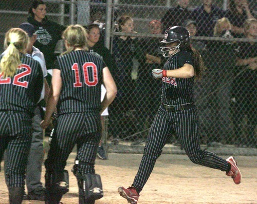 Paul Fraughton / Salt Lake Tribune
Weber High's Nicole Weiss comes home after hitting a home run to help her team win the 5A softball championship.

 Thursday, May 24, 2012