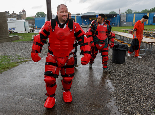 Trent Nelson  |  The Salt Lake Tribune
Weber State students Adam Strader and Joe Fonnesbeck wearing protective suits for a training scenario where they portrayed rioting inmates at the Mock Prison Riot, Wednesday, May 9, 2012 at the West Virginia Penitentiary in Moundsville, West Virginia.