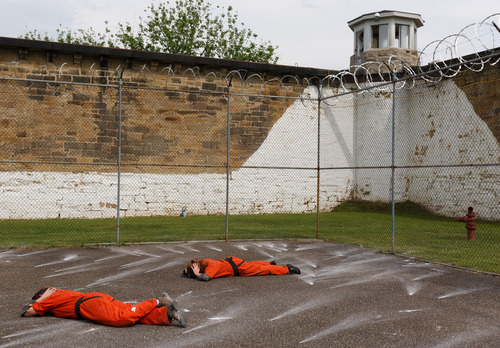 Trent Nelson  |  The Salt Lake Tribune
Weber State students Rachel Taylor, left, and Sarah Cleverley lie prone, role playing as inmates while an emergency response team from the Chemung County (NY) Sheriff's Office moves in during a training scenario at the Mock Prison Riot, Monday, May 7, 2012 at the West Virginia Penitentiary in Moundsville, West Virginia.