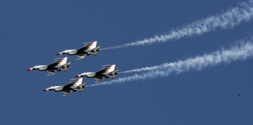 Scott Sommerdorf/The Salt Lake Tribune

The Air Force Thunderbirds precision flight team performs Saturday during the Hill Air Force Base Open House. The event included a variety of flight demonstrations, displays of military airplanes and hardware and a concert. The open house continues Sunday.
