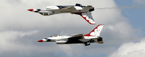 Scott Sommerdorf/The Salt Lake Tribune
The Air Force Thunderbirds solo pilots performs a mirror maneuver during the Hill Air Force Base Open House on Saturday. The event included a variety of flight demonstrations, displays of military airplanes and hardware and a concert. The open house continues Sunday.