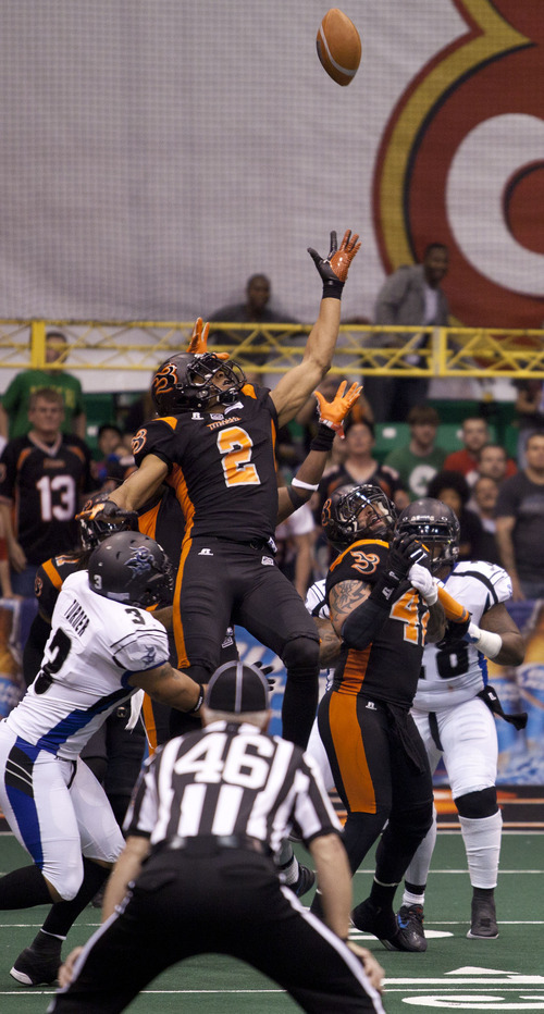 Lennie Mahler  |  The Salt Lake Tribune
Utah Blaze's Jeremy Kelley reaches out above the pack to recover an onside kick near the end of the first half against the San Antonio Talons on Saturday, May 26, 2012, at EnergySolutions Arena.