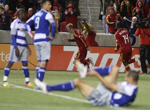 Rick Egan  | The Salt Lake Tribune 

FC Dallas players seem stunned as Nat Borchers (6) celebrates with after scoring the game winning goal, to give Real Salt Lake a 3-2 win over FC Fallas, in MLS soccer action, Real Salt Lake vs FC Dallas, in Sandy, Saturday, May 26, 2012.