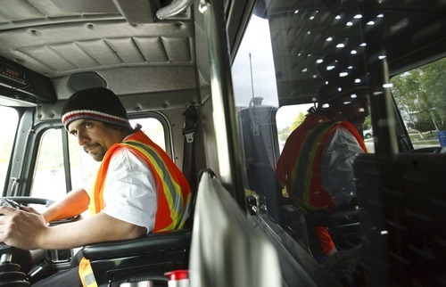 Leah Hogsten  |  The Salt Lake Tribune
Salt Lake County sanitation employee Saul Lopez picks up recycling Friday, May 25, 2012, in Kearns. Lopez is the recipient of a national Driver of the Year award.
