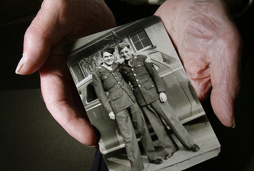 Scott Sommerdorf  |  The Salt Lake Tribune             
David Parry holds this photo, Monday, May 21, 2012 of him, left, and his brother, Ed, home on leave during their time in the U.S. Army. David Parry served in Europe during World War II, and is still active in his business, Parry Office Supply & Machines in Holladay.  He's still at work at age 88. Lue Baadsgaard, a regular customer has written his story.