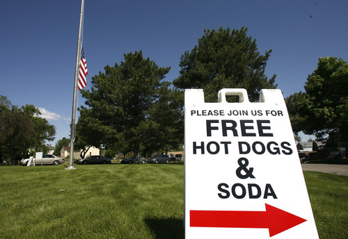 Rick Egan  | The Salt Lake Tribune 

Free hot dogs and soda were served at the Valley View cemetery in West Valley, Monday, May 28, 2012. Valley VIew Cemetery offers free hot dogs and sodas to people visiting their family's graves, as well as face painting.