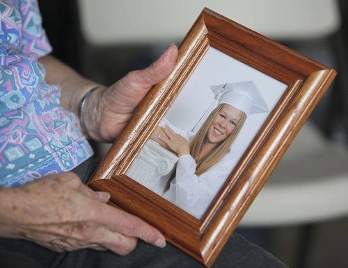 Lennie Mahler  |  The Salt Lake Tribune
Laraine Reid holds a graduation photo of her granddaughter, Shantelle Reid, at her home in West Jordan on Tuesday, April 10, 2012. Shantelle was shot to death allegedly by 31-year-old Ryan Robinson in Murray on Monday, April 9.