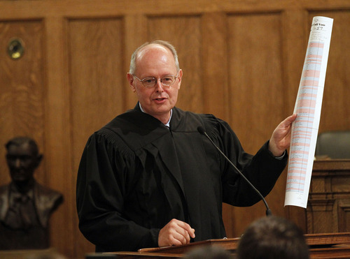 Al Hartmann  |  The Salt Lake Tribune 
U.S. District Court Judge David Nuffer speaks to audience at the Frank Moss Federal Courthouse in Salt Lake City on Tuesday after being sworn in. He holds in his hand the roll call vote from the U.S. Senate that confirmed his appointment.