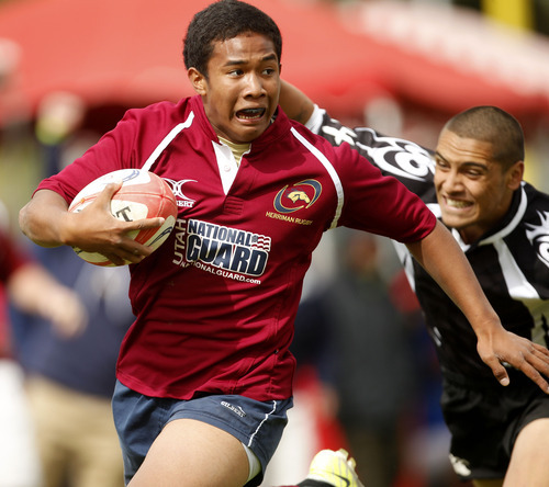 Trent Nelson  |  The Salt Lake Tribune
Herriman's Dallon Burningham runs for an overtime-forcing score in the final moments of the game as Herriman defeated Trybe for the Division 1 state rugby championship Saturday, May 26, 2012 at the University of Utah in Salt Lake City, Utah.