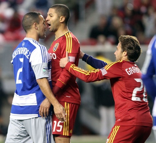 Rick Egan  | The Salt Lake Tribune 

Real Salt Lake midfielder Ned Grabavoy (20) grabs Alvaro Saborio (15), as he has a few words with Daniel Hernandez (2) Dallas, in MLS soccer action, Real Salt Lake vs FC Dallas, in Sandy, Saturday, May 26, 2012.