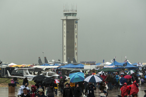 Chris Detrick  |  The Salt Lake Tribune
Spectators walk through the rain during the Warriors Over the Wasatch airshow at Hill Air Force Base Saturday May 26, 2012.