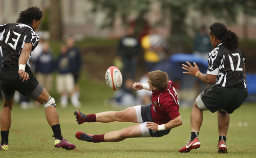 Trent Nelson  |  The Salt Lake Tribune
Herriman's Brandon Jensen flies into a collision with Trybe's Junior Vailolo as Herriman defeated Trybe for the Division 1 state rugby championship Saturday, May 26, 2012 at the University of Utah in Salt Lake City, Utah. Jensen was injured on the play and taken off the field on a stretcher.