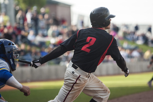 Chris Detrick  |  The Salt Lake Tribune
American Fork's Riley Ottesen hits the game winning RBI during the 5A championship game at Kearns High School. American Fork won the game 5-4.