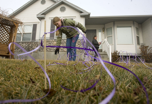 Al Hartmann  |  The Salt Lake Tribune 
Friends and family of Susan Powell put purple ribbons around her West Valley City home in 2010, along with signs saying that she is loved, missed and that she will be found. The missing woman's parents now have control of the home.